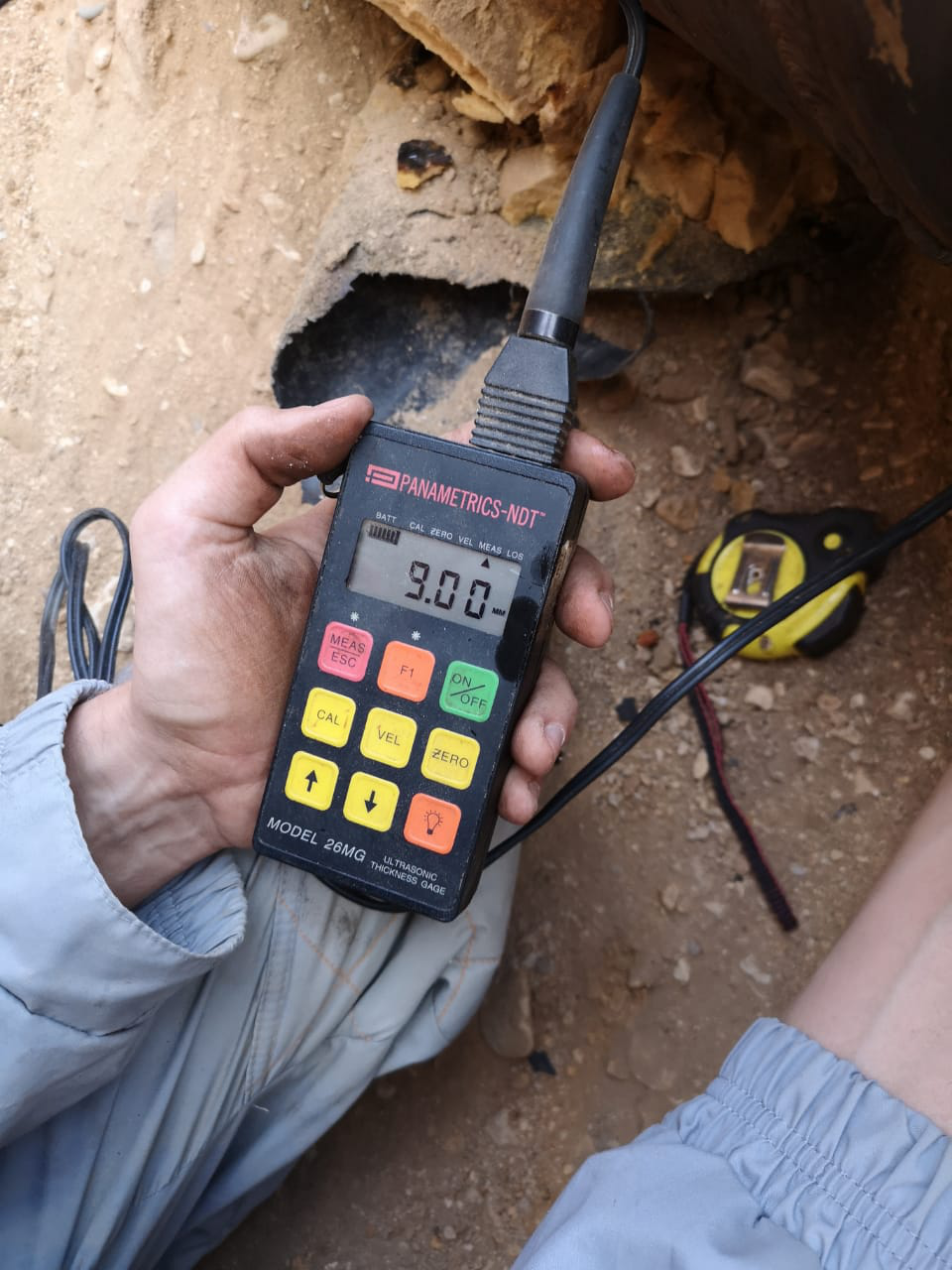 Operator holding the MTM magnetometer on site